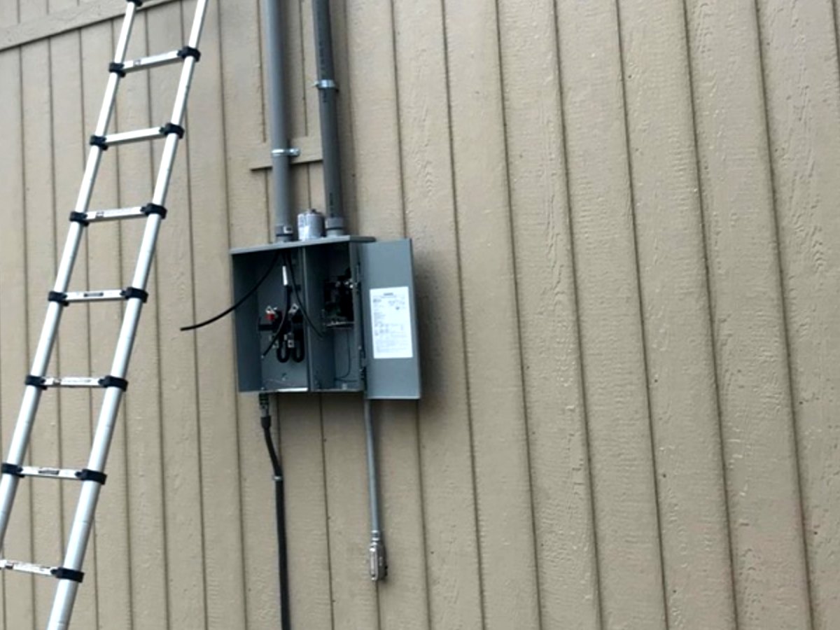 Electrical service panel and conduit installation in progress on a Memphis-area property.